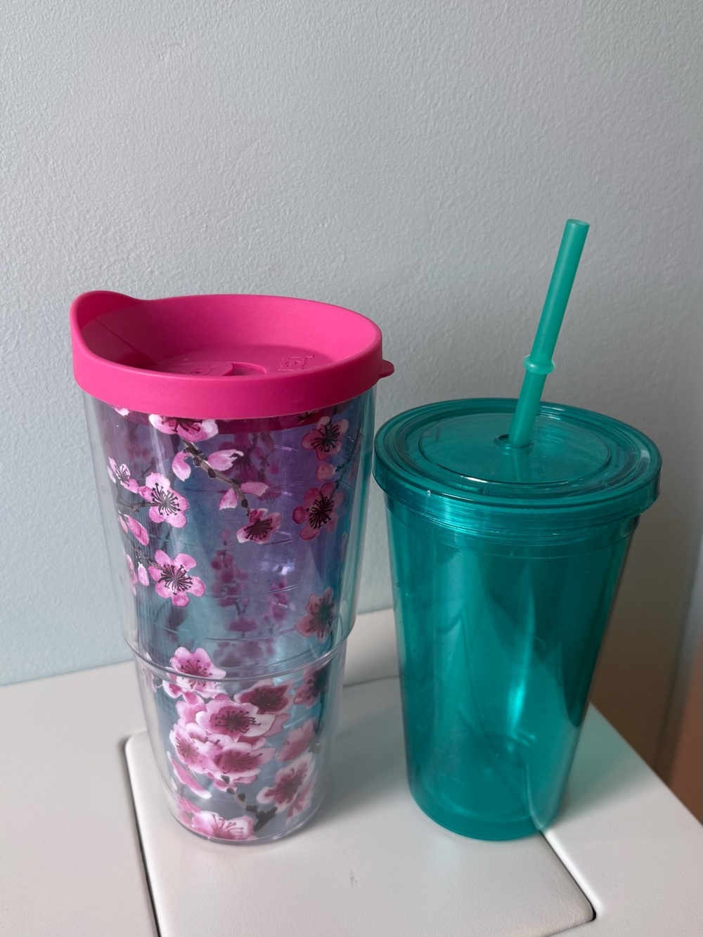 Two Water Bottles :  
1. Pink Floral Insulated Tumbler
2. Green water bottle!